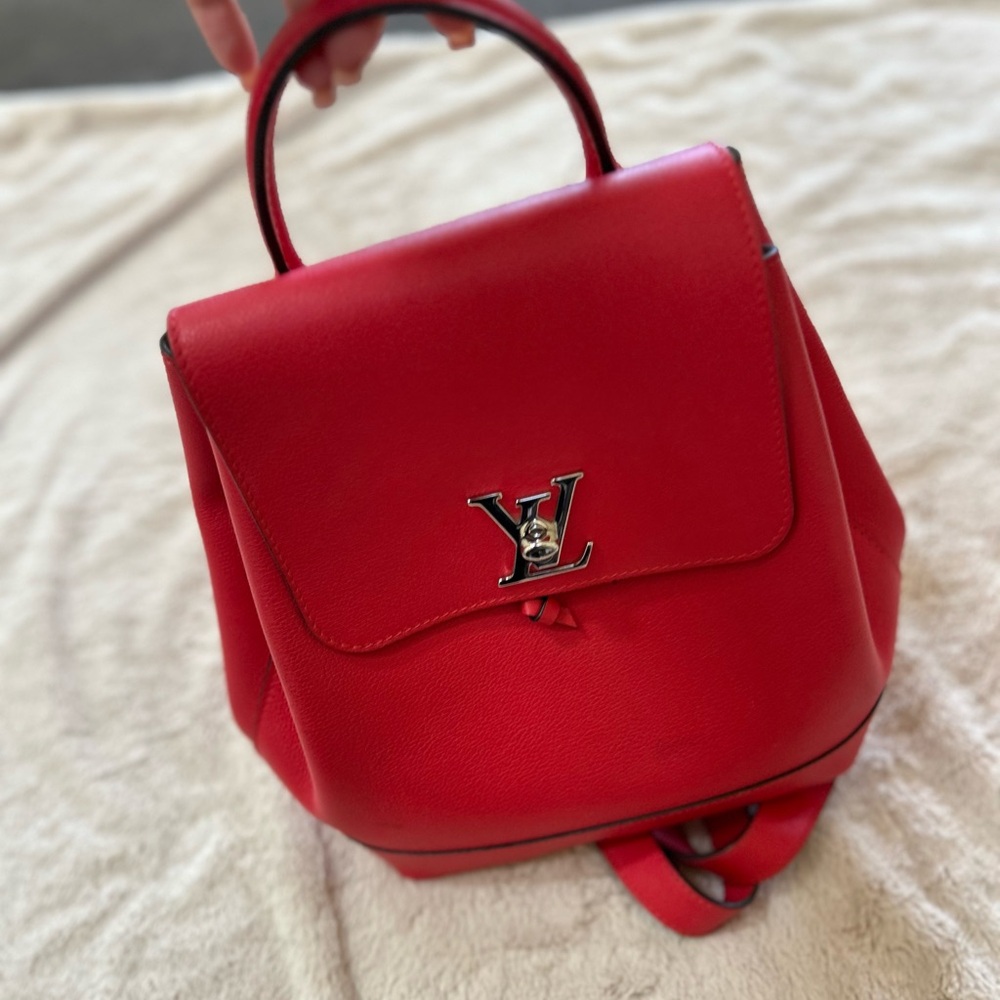 Louis Vuitton Red Pebbled Leather Backpack with Silver LV Lock - Picture 2 of 5